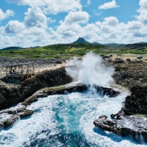 Shete Boka National Park Curaçao with dramatic waves crashing into rocky inlets and sea caves.
