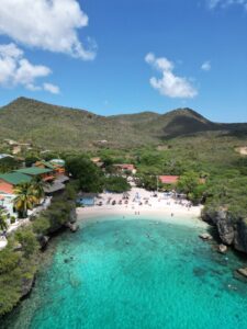 Snorkeler exploring colorful coral reef in Curaçao