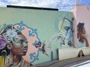 Travelers exploring Curaçao on a budget, visiting colorful Willemstad, local markets, and free beaches.