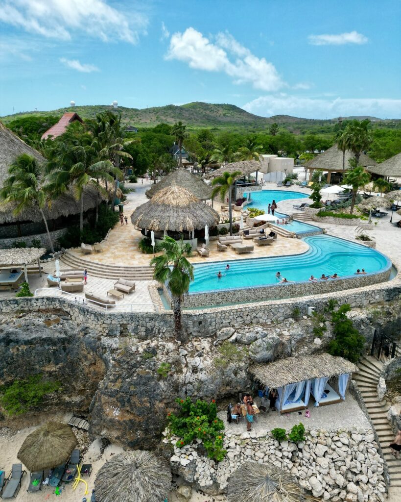 Outdoor pool and beach view at Bed & Bike Westpunt Curaçao