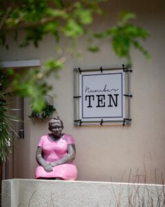 Children playing at a kid-friendly restaurant in Curaçao with outdoor seating, tropical garden, and family-friendly atmosphere.