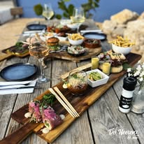 Children playing at a kid-friendly restaurant in Curaçao with outdoor seating, tropical garden, and family-friendly atmosphere.