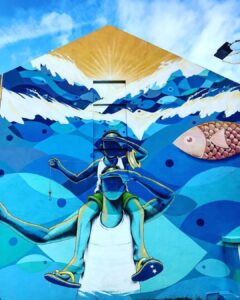 Locals playing domino at a Curaçao snek with laughter and drinks on the table