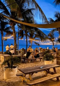 Children playing at a kid-friendly restaurant in Curaçao with outdoor seating, tropical garden, and family-friendly atmosphere.